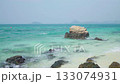 Sea landscape with rocks on the beach Beautiful blue water with waves 133074931