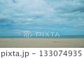 Sand with blurred ocean water wave tropical beach bokeh background, summer vacation and travel concept with copy space, Thailand 133074935
