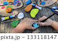 Focused Little Children Painting Stone with Bright Acrylic Colors During Creative Art Activity at Home DIY Craft Project for Kids, Childhood Learning and Fun Indoor Hobby Concept 133118147