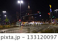 Dynamic night timelapse of Warsaws city center, capturing traffic lights, passing cars and the illuminated Palace of Culture under a dark sky. 133120097