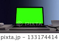 Greenscreen display on laptop set on white table. Blue Background. Close up of chroma key on screen for Video Call, Website Template Presentation Game Applications. Freelance Business. Zoom in 133174414