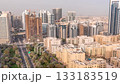 Skyscrapers in Barsha Heights district and low rise buildings in Greens district aerial timelapse. Dubai skyline 133183519