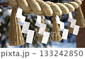 Winter shrine decorations of shimenawa with paper streamers swaying in the snow 133242850