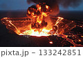 Violent eruption of the crater, engulfed in black smoke and spewing lava 133242851