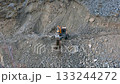 Construction equipment, a wheeled excavator, collects stones. November 15, 2025, Kyrgyzstan, Ak-Tyuz 133244272