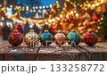 Colorful christmas ornaments displayed at a festive holiday market. 133258772