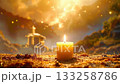 Candle glowing, symbolizing remembrance, hope, and spiritual serenity near distant temple. 133258786
