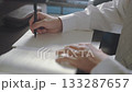 A high school student studying and holding a mechanical pencil 133287657