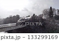 Steam locomotive crossing the snow-covered Kinugawa River iron bridge│Retro steam locomotive in winter│Pan shot 133299169
