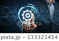 Hand and floating gear icon symbolizing futuristic business operations 133321454