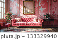Elegant coral room features sofa, armchair, rug, artwork, and natural light. 133329940
