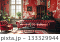 Red velvet sofa and armchair sit in a living room with red, textured walls. 133329944