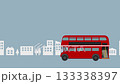 A red double-decker bus running through the city 133338397