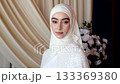 Chechen bride in hijab looks at camera in elegant wedding interior in slow motion 133369380