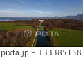 Aerial view of Neue Schloss Herrenchiemsee, historic monument located on Herreninsel in Bavarian municipality of Chiemsee. Drone shot of Herrenchiemsee Palace Park, the Bavarian Versailles, Germany 133385158