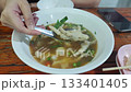 4K High Angle Footage of Tom Saap Gai, Popular Thai Comfort Food Dish 133401405
