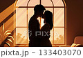 Silhouette of a couple kissing against a sunset window background. The scene conveys romance, love, and intimacy. Perfect for Valentine's Day designs or romantic illustrations. 133403070