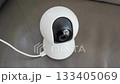wireless ip camera monitoring home interior showing smart device 133405069