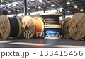 Fiber optic internet cable spools and coils in a warehouse of cable factory, 3d animation 133415456