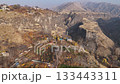 aerial view of Garni village in Azat Gorge and walls of Symphony of Stones in Kotayk region of Armenia on sunny autumn evening 133443311