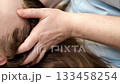 Scalp massage therapy in aesthetic clinic during relaxation skincare treatment. 133458254