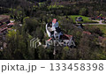 Aerial view of Schloss Elkofen, historic Bavarian castle nestled in green meadows near Grafing, Upper Bavaria. Scenic medieval landmark, blending nature, heritage, timeless architecture. Burg Elkofen 133458398