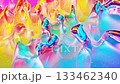 Looped abstract background. Beautiful iridescent wavy surface like surface of christmas toy, gradient color and flow waves on it. Rainbow glossy and matt fluid. Soft smooth animation. 133462340