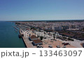 Aerial view drone shot of Vila Real de Santo Antonio Algarve Aerial perspective of active beachfront promenade filled with cafes Vivid aerial outlook over dynamic coastal walkways dotted with numerous 133463097