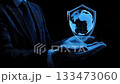dark background with businessman open palm, hovering 3D shield and globe grid 133473060