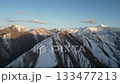 Majestic mountain range panorama with dynamic aerial camera movement 133477213