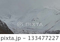 Snowy mountain landscape with gradual zoom in on rugged terrain details 133477227