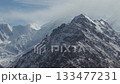 Majestic snow-capped mountains captured in a sweeping panoramic view 133477231