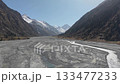 Scenic mountain valley landscape with flowing river, camera pans across scene 133477233
