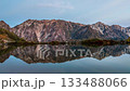 Timelapse of autumn leaves of the Hakuba Sanzan mountains reflected in Happoike Pond at dawn 133488066