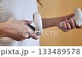 Hands Holding Virtual Reality Headset Controllers 133489578