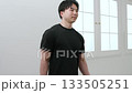 A man in his 20s doing muscle training with dumbbells A man in his 20s doing muscle training with dumbbells 133505251