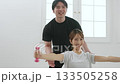 Young woman receiving training from a personal trainer Young woman receiving training from a personal trainer 133505258