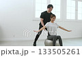 Young woman receiving training from a personal trainer Young woman receiving training from a personal trainer 133505261