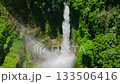 Tropical waterfalls surrounded by forest. Hikong Bente Falls in Lake Sebu. Mindanao, Philippines. Slow motion. 133506416