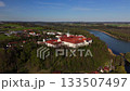 Aerial view Luftaufnahme of Attel Monastery and St. Michael Church on Attel Hill by Inn River, near Wasserburg am Inn, Bavaria. Historic Benedictine site, scenic spring landscape, rural Germany charm 133507497