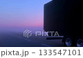 Truck driving on the highway at sunrise with scenic sky. Pink and violet long distance transportation scene in the morning 133547101