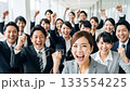 A large number of business people making a fist pump A large number of business people making a fist pump 133554225