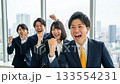 A large number of business people making a fist pump A large number of business people making a fist pump 133554231
