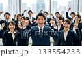 A large number of business people making a fist pump A large number of business people making a fist pump 133554233