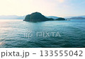 A view of a small uninhabited island from the ferry to Shodoshima in Kagawa Prefecture in the Seto Inland Sea 133555042