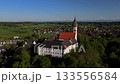 Panorama Kloster Andechs in der Gemeinde Andechs, Oberbayern, Deutschland. Historisches Benediktinerkloster und Wallfahrtskirche auf dem Heiligen Berg am Ammersee.  133556584