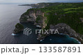 Bali Nusa Penida Banah Cliff Point rock arch aerial drone sea coast sunset 133587891