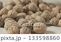 Harvested brown whole walnuts 133598860