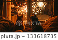 New Year's Eve fireworks seen through a warm living room window with a curious cat and dog 133618735