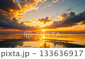 Sunset sky and flowing clouds reflected on the sea 133636917